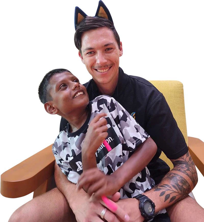 caretaker sitting with old person